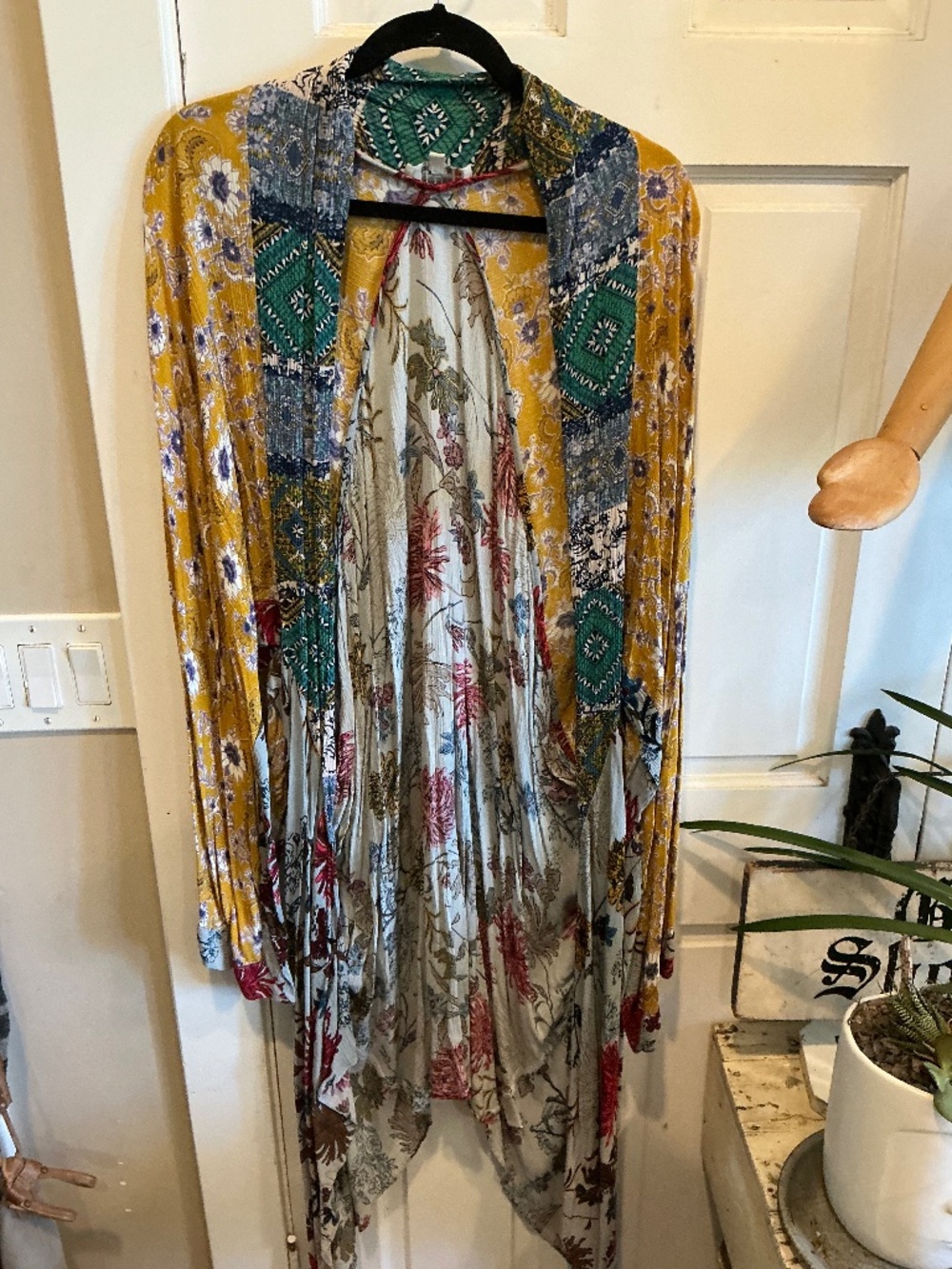 Umgee sleeveless kimono wrap in glorious color and yarn embroidered details!